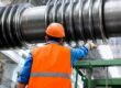 Industrial Worker Inspecting Heavy Machinery